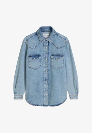 Light blue denim shirt with long sleeves, button-up front, pointed collar, and two chest pockets. Features a curved hem and stitched details.
