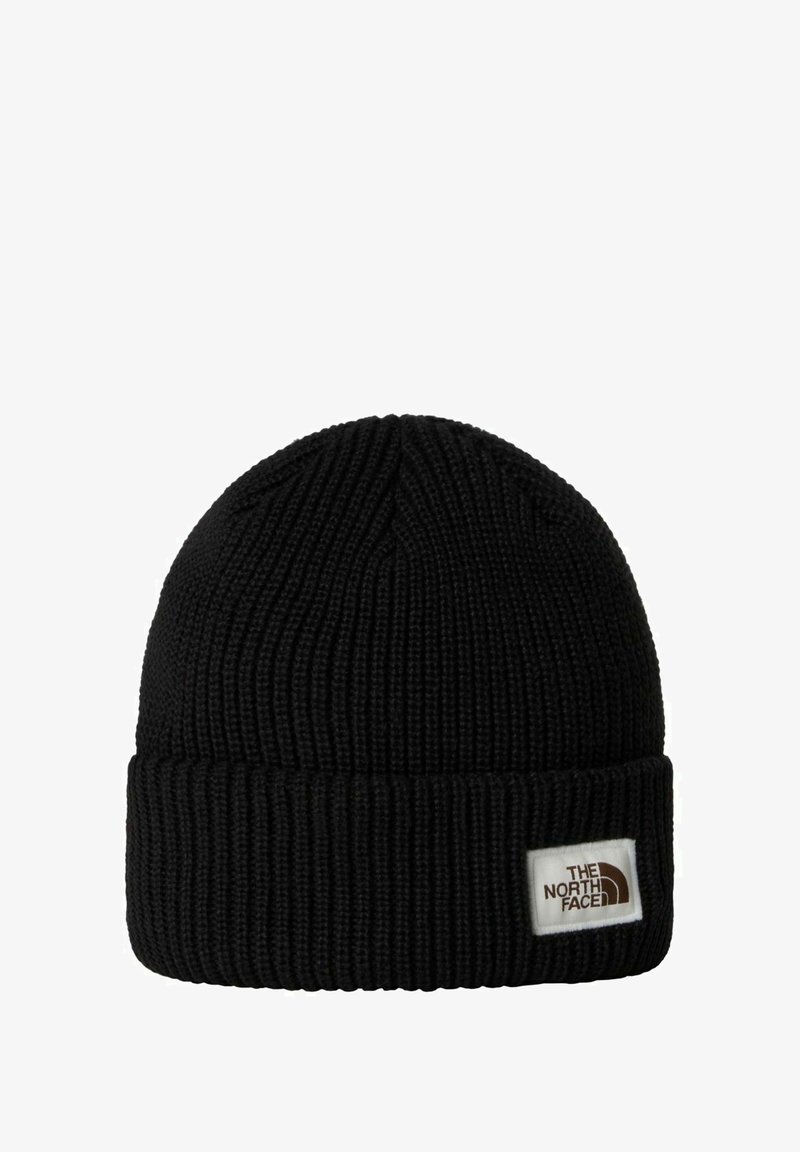 Mustassa neulepipossa on ribattua pintarakennetta, taitettu nyrkki ja edessä valkoinen etiketti, jossa on The North Face -logo.