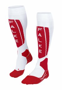 Calze bianche fino al ginocchio con accenti rossi, caratterizzate dal logo FALKE, vestibilità ergonomica, pannelli testurizzati e suole imbottite per il comfort.