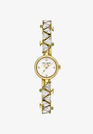 Goldene Kate Spade Armbanduhr mit weißem Zifferblatt, Kristall-Stundenmarkierungen, goldfarbenen Zeigern und einem Band, das mit großen klaren und kleinen grünen Edelsteinen geschmückt ist.