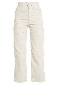 Vita kordflorsbyxor med hög midja och breda ben, med framfickor, knappstängning och vertikal ribbad textur genom hela byxan.