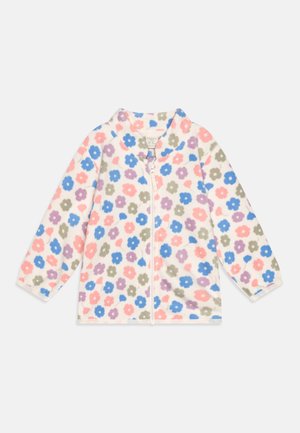 Fleece-jakke med lynlås og blomstermønster i pink, blå, lilla og grøn på en cremefarvet baggrund. Har en opretstående krave og lange ærmer.