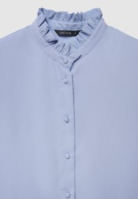 Light blue blouse featuring a frilled collar, front buttons, and smooth texture. Label reads "CALLIOPE," size small.