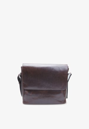 Brown leather messenger bag with a smooth texture, a flap closure, and an adjustable shoulder strap. Features minimal hardware accents.