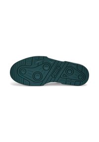 Sål af sko i mørk teal gummi, tekstureret for greb, med cirkulære og trekantede mønstre samt "PUMA" branding.