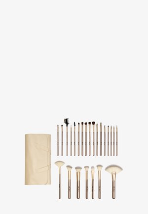 Ensemble de 20 pinceaux de maquillage en or rose avec différentes formes de poils, plus une pochette beige assortie pour pinceaux, présenté sur fond blanc.