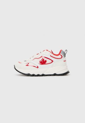 White sneaker with red accents, featuring textured upper, mesh panels, and a red maple leaf logo. Thick black sole with zigzag tread.