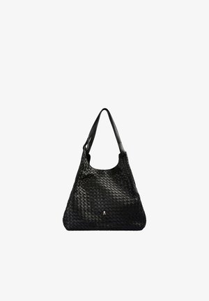 Sac à main en cuir noir avec motif tissé, bandoulière unique et petit détail métallique en forme de crâne au centre avant.