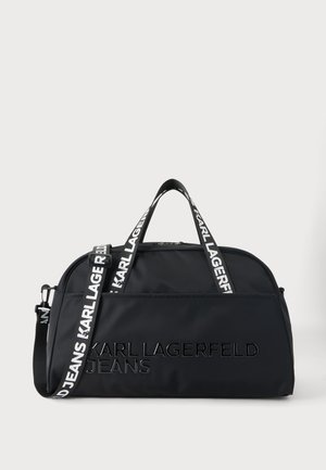 Sac de voyage duffel noir Karl Lagerfeld Jeans avec double poignée et bandoulière réglable marquée, sur un fond neutre.