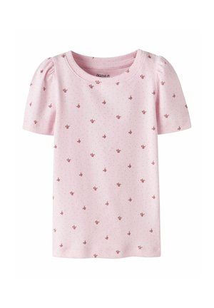 Light pink short-sleeve toddler shirt with small red flower and tiny dot patterns, slightly gathered shoulders, and round neckline.