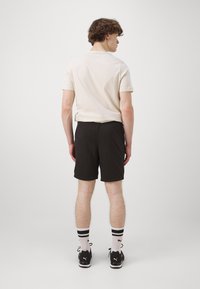 Puma ESSENTIALS - Športové šortky - black