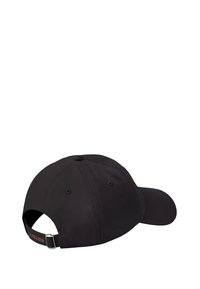 Black baseball cap with adjustable metal strap at back and ventilation eyelets on top panels, shown from rear side angle.