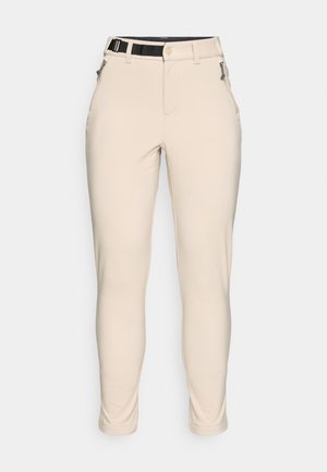 Beige, tettsittende bukser med teksturert stoff. Har en svart justerbar midjebånd og glidelåslommer på sidene.