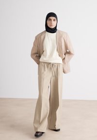 BOSS TAMAYA - Hlače - beige