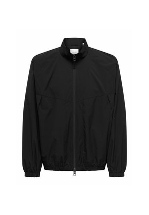 Veste légère noire avec fermeture éclair intégrale à l'avant, col montant, manches longues et poignets et bas élastiques.