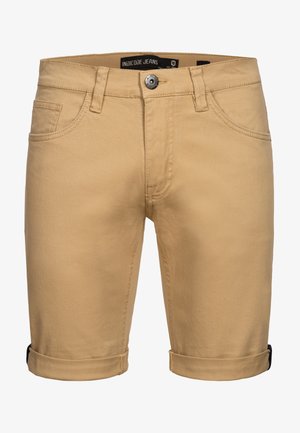 Beige bomullshorts med rullet kant, frontlommer og metallknapplukking, med minimale sømdetaljer.