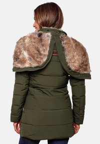 Green puffer jacket with a faux fur shoulder accent. Features a zip closure, textured fabric, and a fitted waist for shape.