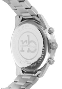 Roostevabast terasest kell ümmarguse korpusega, kolme krooniga nuppudega, graveeritud logoga tagaküljel ning poleeritud käevõruga, kus on metallist lingid.