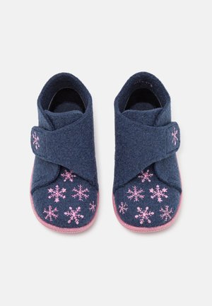 Navy blue children's slippers with pink snowflake embroidery, wrap-around straps, and pink soles on a white background.