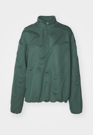 Green quilted pullover with a high collar and half zip. Features a textured pattern and elasticated hem for adjustable fit.