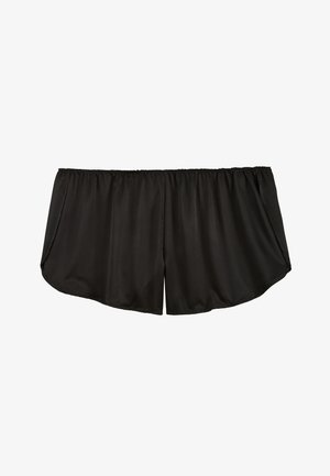 Shorts noirs à taille élastique avec tissu fluide et ample et ouvertures latérales, conçus pour le confort et un usage décontracté.