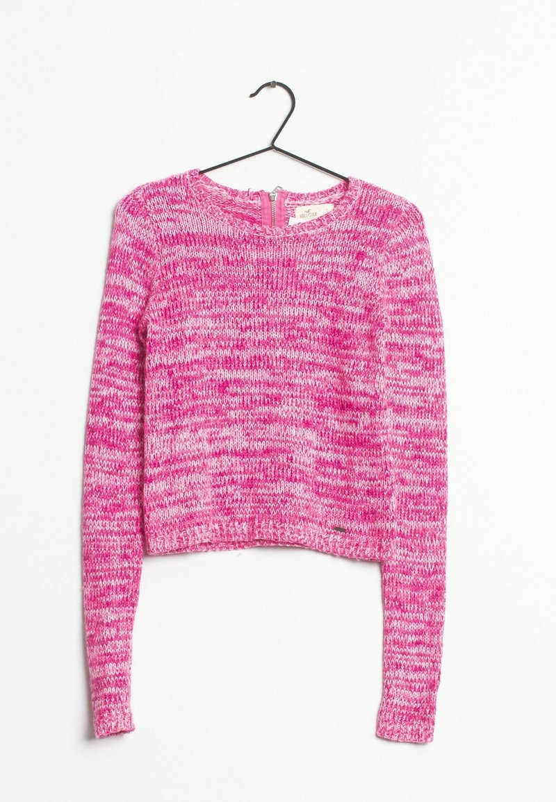 Pull court rose avec des manches longues, texture en tricot et encolure ronde. Présente une fermeture éclair dans le dos. Motif multicolore.
