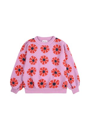 Pink sweatshirt featuring a repeating pattern of red flowers with black centers. Designed with a round neckline and puffed sleeves.