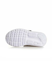 Suela de zapato de goma blanca texturizada, con patrones circulares y en forma de ola para agarre y tracción, punta redonda y bordes contorneados.
