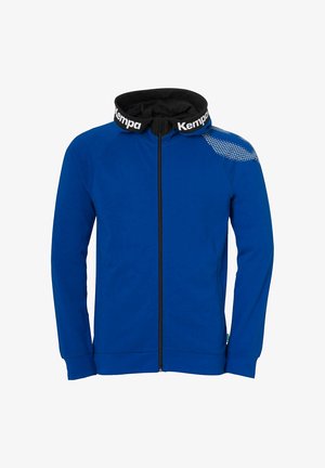 Sudadera con cremallera azul y cuello negro con la marca "Kempa". Presenta mangas raglán, bolsillos laterales y un patrón texturizado en el hombro.