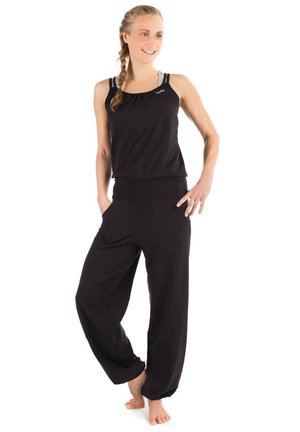 Black sleeveless top with a gathered neckline, paired with loose black pants featuring side pockets and an elastic waistband.