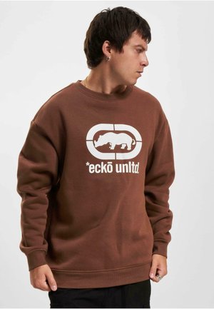 Brun sweatshirts i bomuld med ribbet halsudskæring og manchetter. Har et stort hvidt grafisk motiv af en næsehorn og teksten "*eckō unltd."