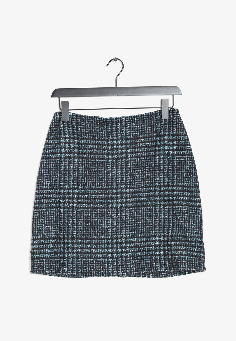Jupe crayon taille haute noire et bleu sarcelle à motif pied-de-poule suspendue à un cintre noir sur fond blanc.