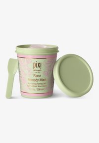 Contenitore di plastica verde con un'etichetta rosa decorata con motivi floreali. Contiene una maschera gel tonificante con rose e include un applicatore coordinato.