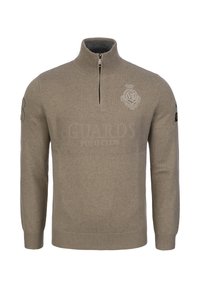 Beżowy sweter z zamkiem i rękawami wykonany z miękkiej dzianiny. Posiada logo w kształcie tarczy na piersi oraz ściągacze przy mankietach i u dołu. Elegancki, minimalistyczny design.