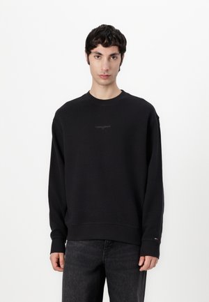 Black cotton sweatshirt with a ribbed texture, crew neck, and embroidered logo on the chest. Features long sleeves and solid color design.