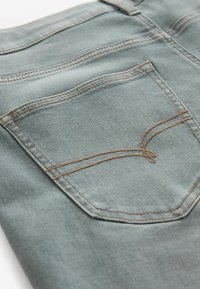 Next MOTION FLEX STRETCH - Prigludę džinsai - mottled light grey