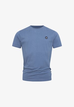 Maglietta in cotone blu con scollatura rotonda e maniche corte. Presenta un piccolo logo ricamato nero sul petto. Tessuto dalla superficie liscia.