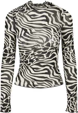 Duga majica s dugim rukavima i lažnim izrezom, s crno-bijelim uzorkom zebra na prozirnom materijalu. Ruffle detalji na izrezu i manžetama.