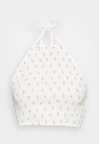 Top halter branco com um design franzido e pequenos padrões florais cor-de-rosa por toda a peça. Prende-se ao pescoço com tiras finas.
