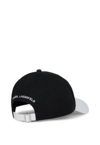Czarny i biały czapka bejsbolowa z regulowanym paskiem, z haftem "KARL LAGERFELD" na tylnym panelu w białym kolorze.