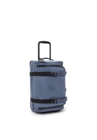 Rolling backpack in navy blue nylon with stitched logo, black straps, and zipper. Features retractable handle and wheels for mobility.