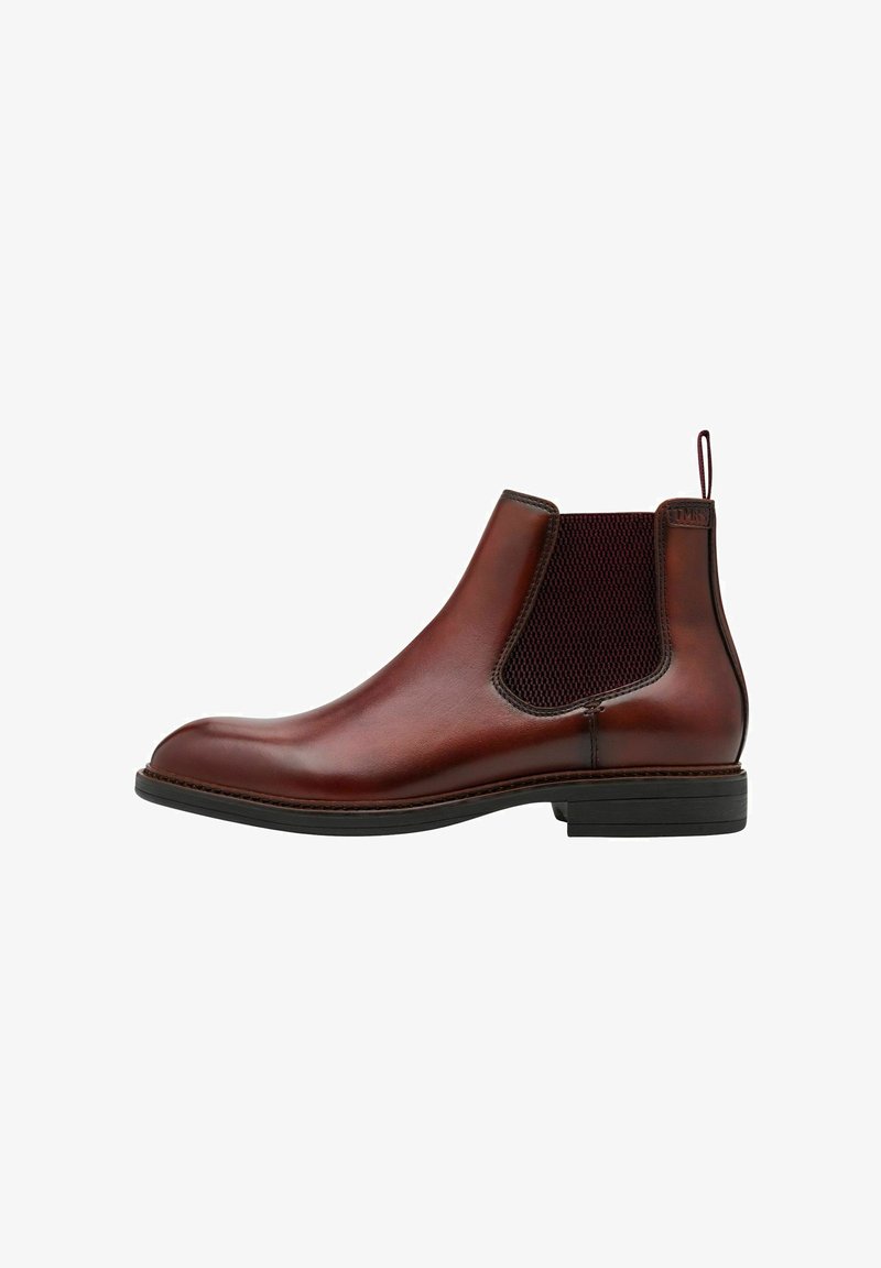 Bottine Chelsea en cuir marron avec panneaux élastiques latéraux, texture lisse, bout rond et un petit talon en caoutchouc noir, dotée d'une languette.