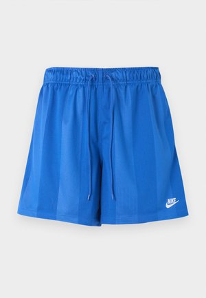 Shorts de sport bleus avec taille élastique et cordon, arborant le logo Nike blanc sur la partie inférieure de la jambe gauche.