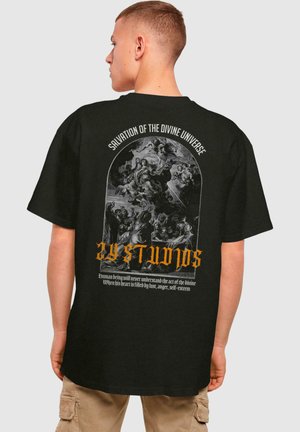 Black short-sleeve t-shirt featuring a detailed graphic print on the back, with white and orange text and religious-themed artwork.