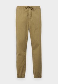 Pantaloni jogger de culoare khaki deschis, cu talie elastică, șnur ajustabil, pantaloni cu picior tapered și manșete elastice. Material neted și respirabil.