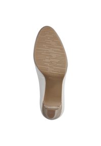 Chaussure à talon blanche avec une surface lisse, dotée d'une semelle en caoutchouc à motifs et d'un bout arrondi. Taille 37 marquée sur la semelle.