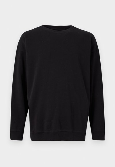 Sweatshirt noir, col rond, manches longues, fabriqué en tissu doux. Dispose de poignets et d'un ourlet côtelés, design minimal sans motifs ni logos.