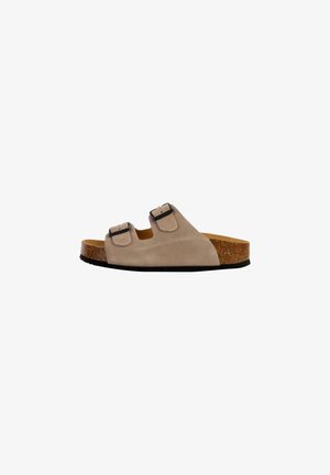 Sandale à glissière en cuir suédé beige avec deux sangles réglables noires à boucle, semelle intermédiaire en liège et semelle extérieure noire texturée.