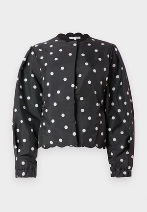 Black satin jacket with white polka dots, gathered at the sleeves, scalloped neckline, and cropped fit, featuring a smooth texture.