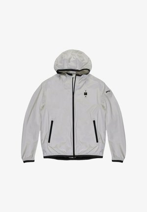 Witte gewatteerde jas met capuchon, zwarte ritsen op de voorzakken en het midden, elastische manchetten en zoom, en een klein logoplaatje op de linkermouw.